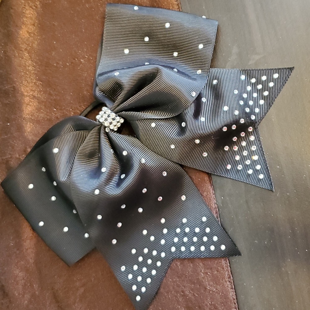 Black ponytail holder with bow and clear rhinestones and studs